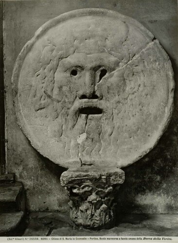 ROMA - Chiesa di S. Maria in Cosmedin - Portico. Ruota marmorea a faccia umana detta Bocca della Verit�